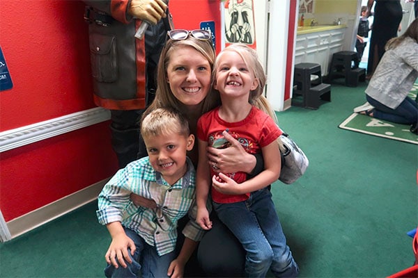 Happy mom with two little kiddos at a Preschool & Daycare Serving Hesperia, CA