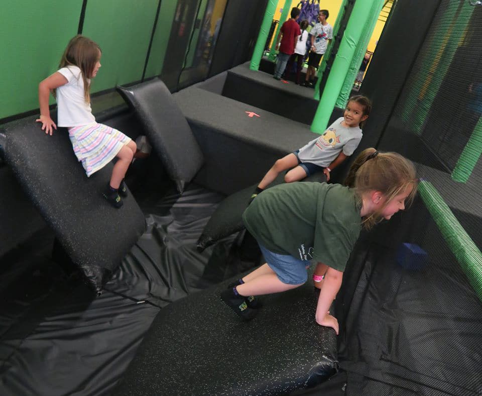 Group of little girls playing in an indoor playground t a Preschool & Daycare Serving Hesperia, CA