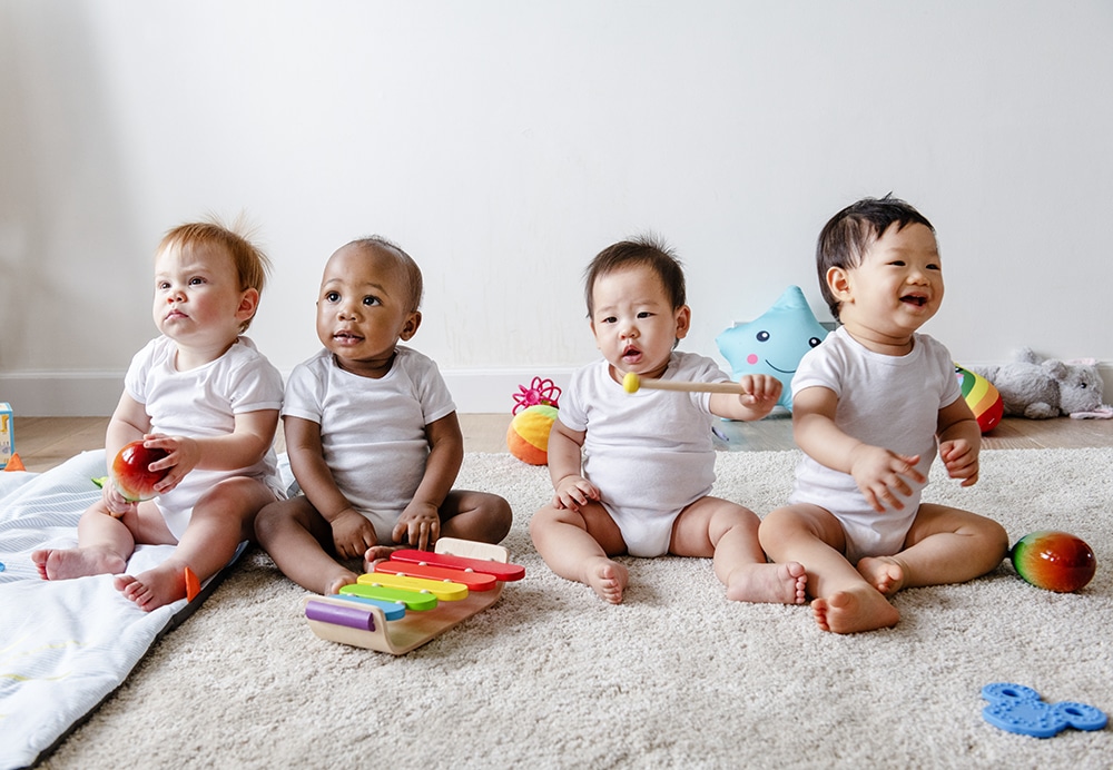 Babies playing together in a play room at a Preschool & Daycare Serving Hesperia, CA